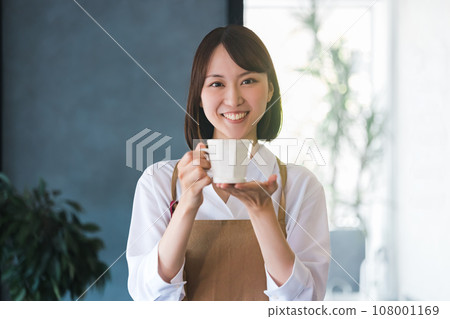 Cafe staff woman with coffee Cafe staff woman with coffee 108001169