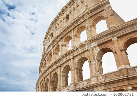 Famous Colosseum with blue sky and clouds in  Rome. Italy. Famous Colosseum with blue sky and clouds in  Rome. Italy. 108001781