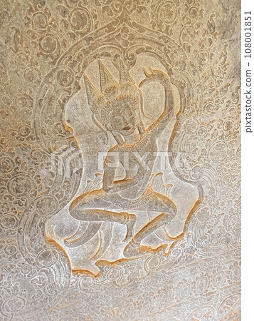 The famous bas-relief of Apsaras, celestial maidens, with intricate hairstyles on the inside wall of the first floor of the Angkor Wat temple in Siem Reap, Cambodia. The famous bas-relief of Apsaras, celestial maidens, with intricate hairstyles on the inside wall of the first floor of the Angkor Wat temple in Siem Reap, Cambodia. 108001851