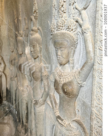 The famous bas-relief of Apsaras, celestial maidens, with intricate hairstyles on the inside wall of the first floor of the Angkor Wat temple in Siem Reap, Cambodia. The famous bas-relief of Apsaras, celestial maidens, with intricate hairstyles on the inside wall of the first floor of the Angkor Wat temple in Siem Reap, Cambodia. 108001937