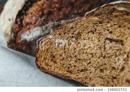 Freshly baked bread with a golden crust close up Freshly baked bread with a golden crust close up 108002552