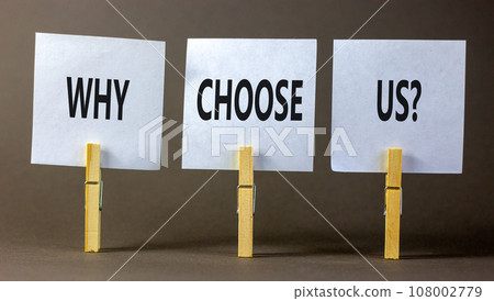 Why choose us symbol. Concept word Why choose us on beautiful white paper on wooden clothespin. Beautiful grey table grey background. Business motivational why choose us concept. Copy space. 108002779