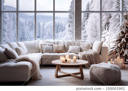 Cozy living room interior with large window, cozy sofa, coffee table and knitted plaid. Winter forest view. Cozy living room interior with large window, cozy sofa, coffee table and knitted plaid. Winter forest view. 108003902