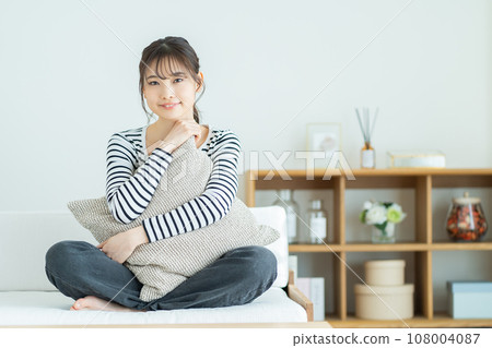 Young woman relaxing on the sofa Woman relaxing at home Woman, smile, girl, casual, college student, new life Young woman relaxing on the sofa Woman relaxing at home Woman, smile, girl, casual, college student, new life 108004087