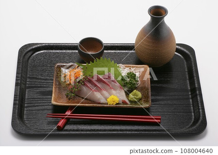 Hamachi sashimi and sake Hamachi sashimi and sake 108004640
