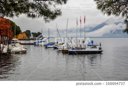 Awe sunny landscape with  sheltering sailboat parking lots in water  of lake   Maggiore in Locarno 108004737