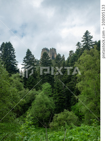 Mountain landscape. Kolokolnaya Mountain in the Republic of Adygea surrounded by a green forest. 108005133