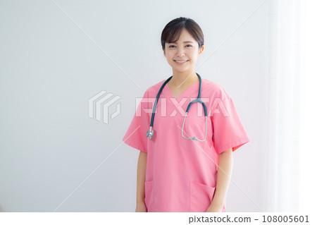Smiling young nurse woman 108005601
