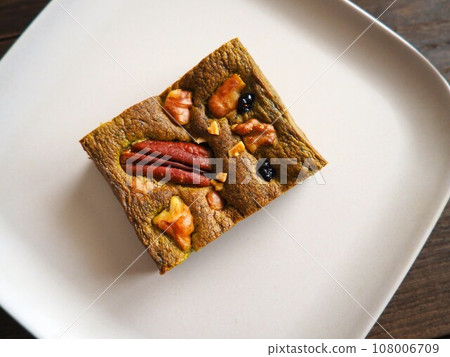 Matcha brownie with nuts and dried fruits Matcha brownie with nuts and dried fruits 108006709