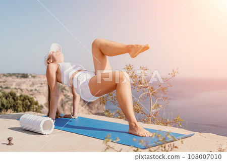 Fit Slim Woman Meditation On Yoga Mat At Outdoor Sports Ground Stock Photo,  Picture and Royalty Free Image. Image 186450158.