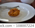 The Deep-fried Shrimp cake, close up Thai food Deep-fried shrimp cake in white plate on a stone table with plum sauce. Crispy Deep-fried Shrimp cake. 108007224