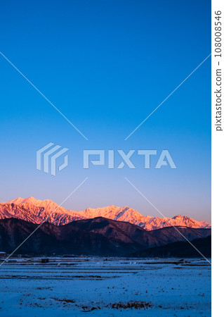Mt. Jigatake, Mt. Kashimayarigatake, Mt. Goryu (Morgenroth) in winter seen from Omachi City 108008546