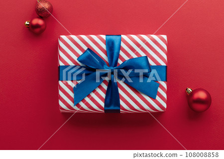 Gift box on color background, flat lay, space for text 108008858