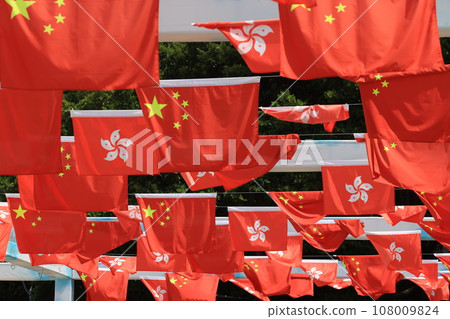 Chinese and hong kong flag set up in the event for celebrating the National Day of the People's Republic of China 74 th anniversary in sheung wan , Hong Kong 108009824