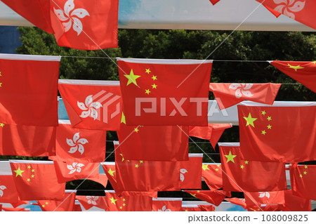 Chinese and hong kong flag set up in the event for celebrating the National Day of the People's Republic of China 74 th anniversary in sheung wan , Hong Kong 108009825