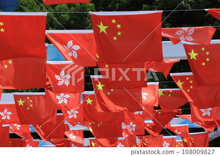 Chinese and hong kong flag set up in the event for celebrating the National Day of the People's Republic of China 74 th anniversary in sheung wan , Hong Kong Chinese and hong kong flag set up in the event for celebrating the National Day of the People's Republic of China 74 th anniversary in sheung wan , Hong Kong 108009827