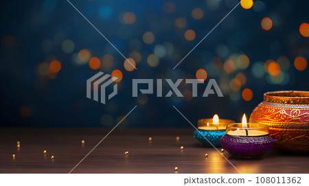 Candles for Diwali holiday on dark background Candles for Diwali holiday on dark background 108011362