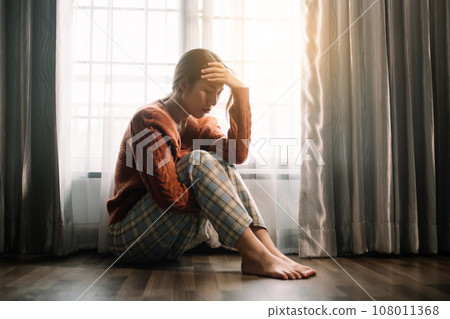 woman sit Depression Dark haired  pensive glance Standing by window and anxiety Copy space. .. 108011368