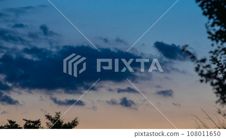 Clouds floating in the sunset sky. silhouette 108011650