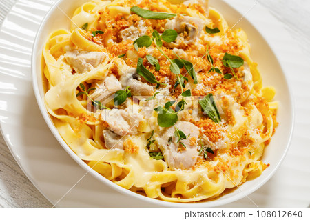 creamy chicken and mushroom tagliatelle in bowl creamy chicken and mushroom tagliatelle in bowl 108012640
