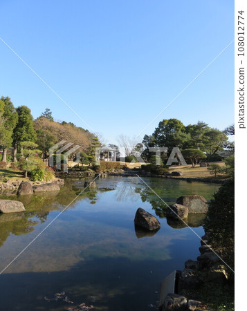 A pond in a Japanese garden A pond in a Japanese garden 108012774