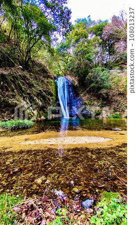 Rainbow waterfall in the middle of nature 108013237