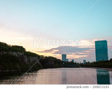 High-rise buildings and the inner moat of Osaka Castle at dusk High-rise buildings and the inner moat of Osaka Castle at dusk 108013281
