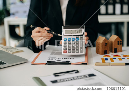 Signing a contract. Client and broker agent, lease agreement, successful deal and Young business sitting at the desk in office Signing a contract. Client and broker agent, lease agreement, successful deal and Young business sitting at the desk in office 108015101