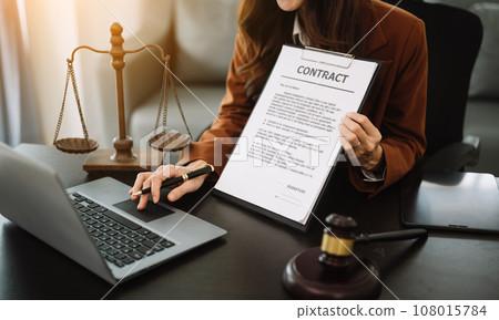 justice and law concept.Male judge in a courtroom on wooden table and Counselor or Male lawyer working in modern office. . 108015784