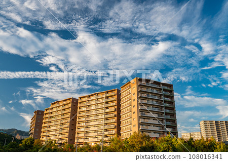 Apartment rising in the setting sun Apartment rising in the setting sun 108016341
