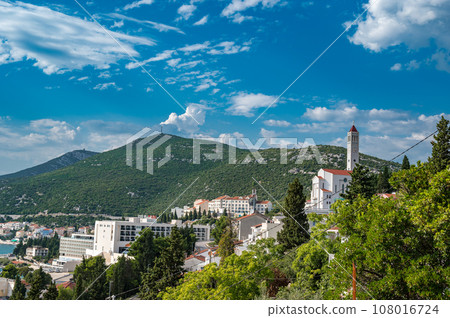 View of Bosnian city of Neum in summer with catholic church Crkva svetog Ivana 108016724