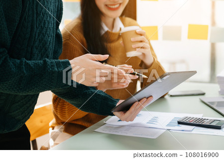 Businessman and team analyzing financial statement Finance task. with smart phone and laptop and tablet. Wealth management concept.. Businessman and team analyzing financial statement Finance task. with smart phone and laptop and tablet. Wealth management concept.. 108016900