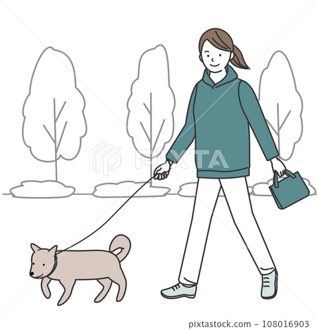 A woman walking a dog A woman walking a dog 108016903