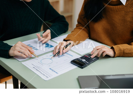 Businessman and team analyzing financial statement Finance task. with smart phone and laptop and tablet. Wealth management concept.. Businessman and team analyzing financial statement Finance task. with smart phone and laptop and tablet. Wealth management concept.. 108016919
