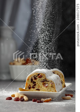 Traditional fruit cake for Christmas with raisins and nuts. Traditional fruit cake for Christmas with raisins and nuts. 108017373