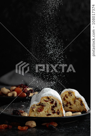 Traditional fruit cake for Christmas with raisins and nuts. 108017374
