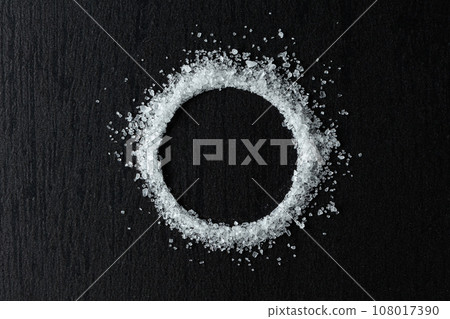 Sea salt on a black table. 108017390