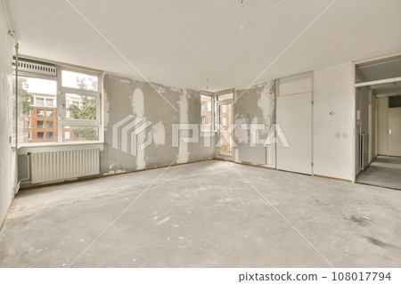 an empty room with white walls and no one person standing in the room, or someone's house is on the other side 108017794