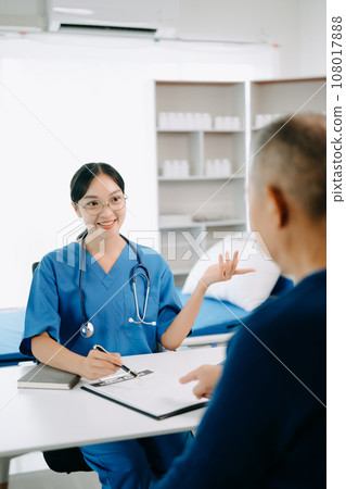 Serious Asia female doctor using clipboard is delivering great news talk discuss results or symptoms with female patient in clinic or hospital . 108017888