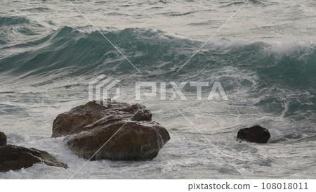 stormy Mediterranean sea waves crushing over rocks stormy Mediterranean sea waves crushing over rocks 108018011