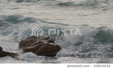stormy Mediterranean sea waves crushing over rocks 108018016
