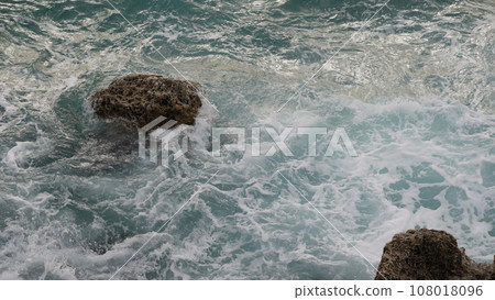 stormy Mediterranean sea waves crushing over rocks 108018096
