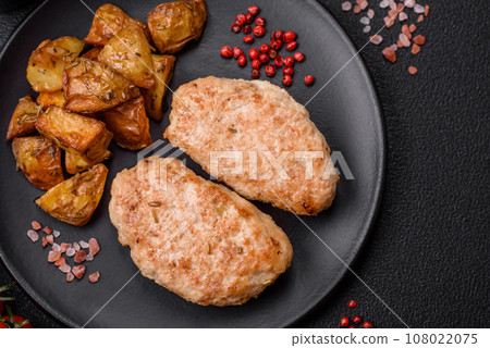 Delicious fresh chicken cutlets or meatballs with salt, spices and herbs Delicious fresh chicken cutlets or meatballs with salt, spices and herbs 108022075