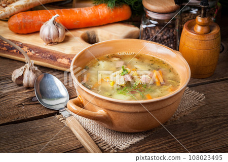 Pea soup with vegetables and bacon. 108023495