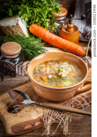 Pea soup with vegetables and bacon. 108023496