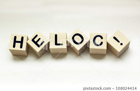 Wooden cubes with HELOC Home Equity Credit Line sign. 108024414