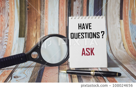 Abstract word Have questions ask on notepad and beautiful background with magnifier and pen. Abstract word Have questions ask on notepad and beautiful background with magnifier and pen. 108024656