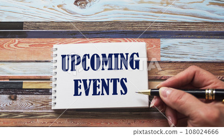 Concept message on a notebook is written by a female hand on a wooden table. Concept message on a notebook is written by a female hand on a wooden table. 108024666