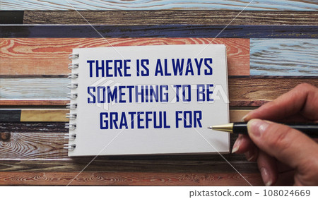 Female hand writes There is always something to be grateful for Female hand writes There is always something to be grateful for 108024669