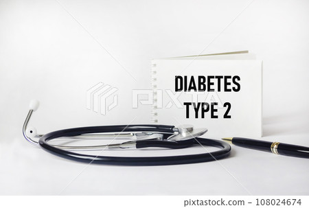 Notepad with words Type 2 Diabetes and stethoscope and pen. 108024674
